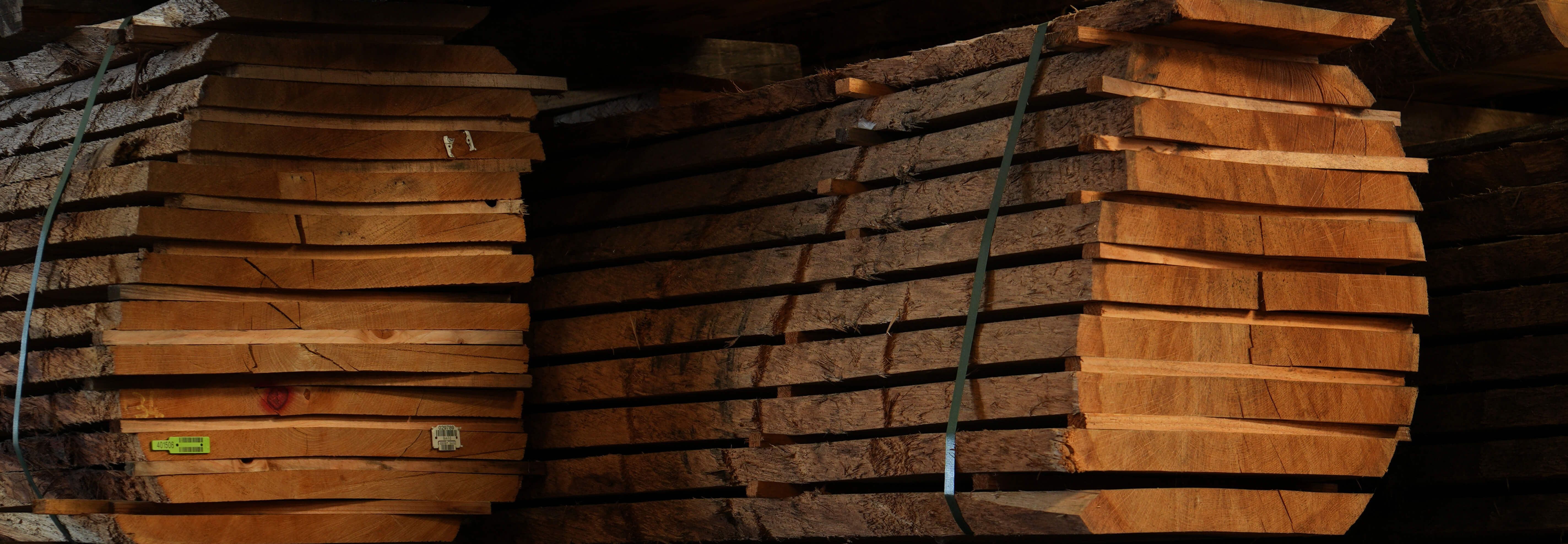 Stacked sawn French oak boards air drying, the raw material behind VOGUE Parquet hardwood flooring