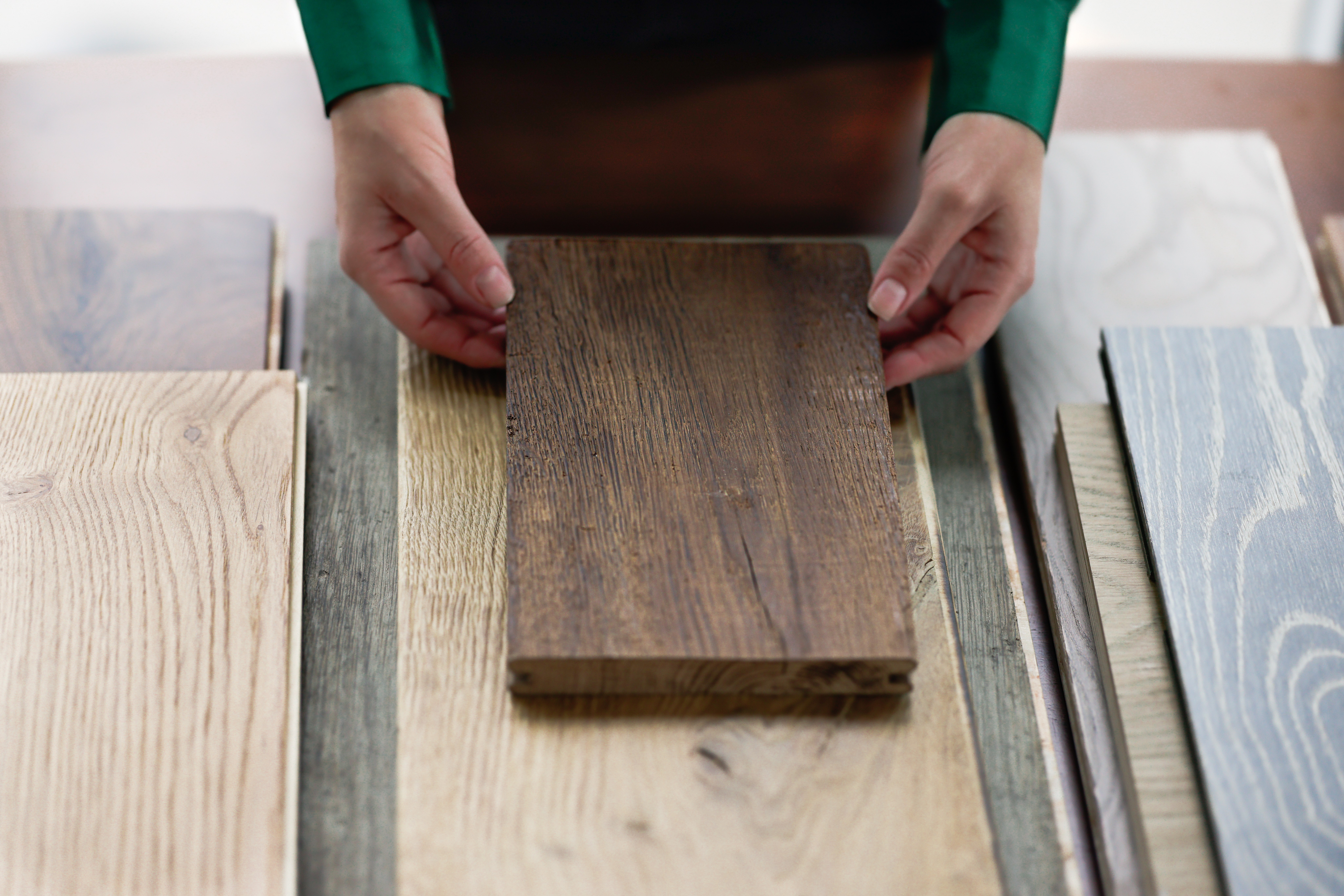 Oak flooring samples compared side by side in different finishes and undertones, VOGUE Parquet hardwood flooring
