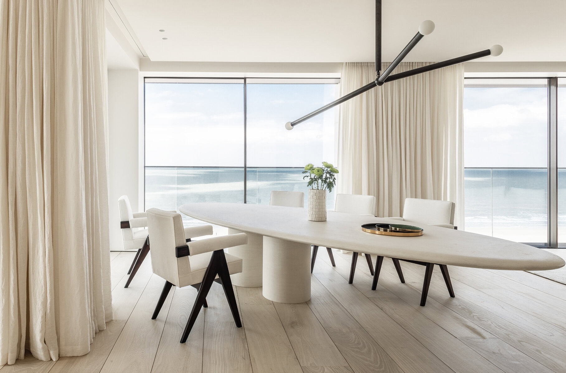 Light tone wide plank flooring minimalist Miami residence
