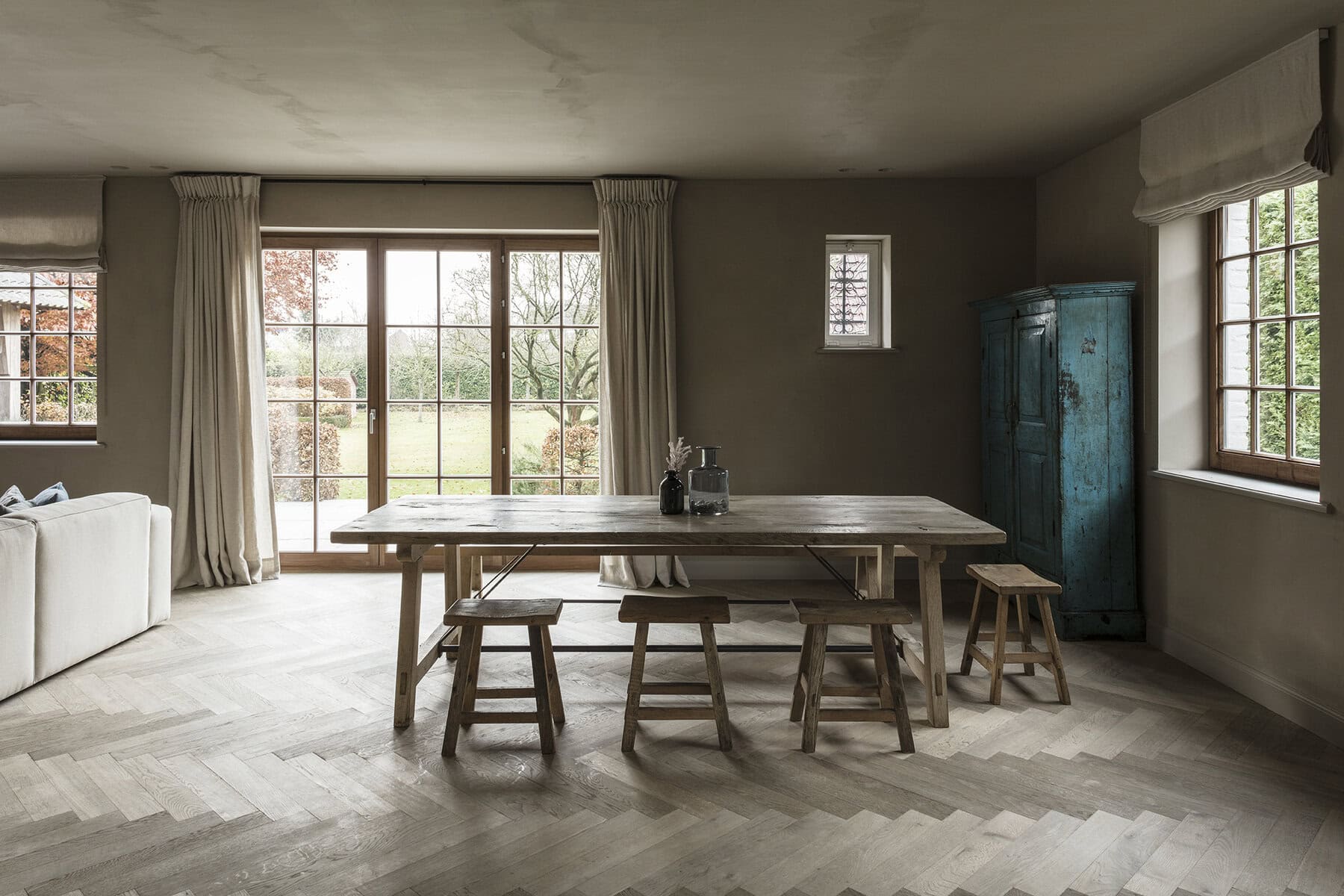Precision herringbone flooring pattern in contemporary residence